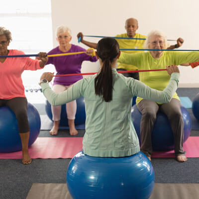 Elders Excersising Wth Trainer